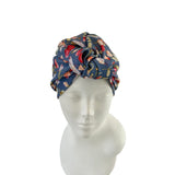 Floral patterned headscarf on a mannequin head against a white background