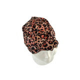 Leopard print headscarf on a mannequin head against a white background