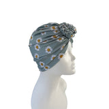 Floral patterned headscarf on a mannequin head against a white background