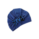 Blue headscarf with a decorative bow on a white background