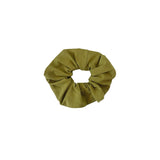 Green scrunchie on a white background