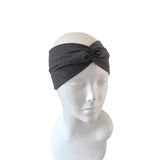 Gray headband on a mannequin head against a white background