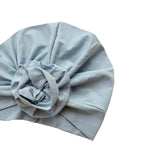 Light blue turban with a knot on a white background