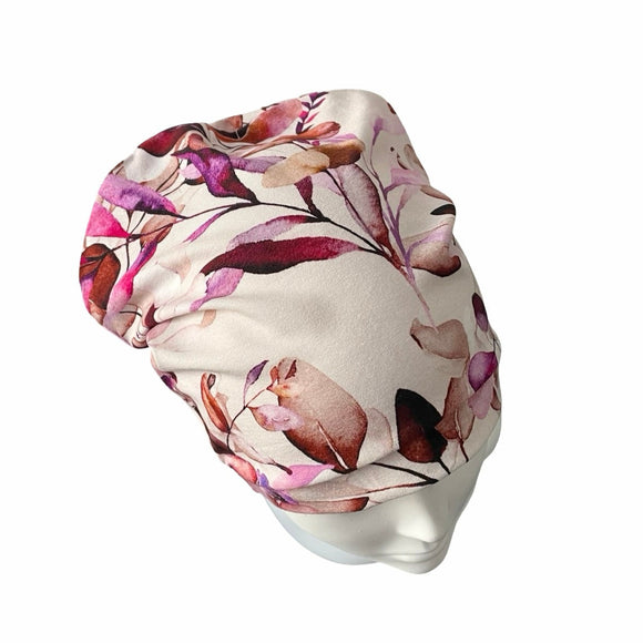 Floral patterned beanie hat on a white background