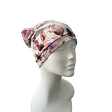 Floral patterned headscarf on a mannequin head against a white background