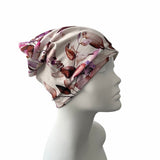 Floral patterned headscarf on a mannequin head against a white background