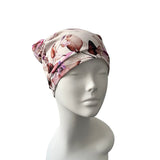 Floral headscarf on a mannequin head against a white background