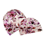 Two floral-patterned beanie hats on a white background
