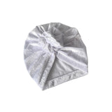 Silver glittery headband on a white background