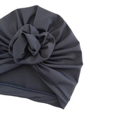 Dark gray turban with a knot on a white background