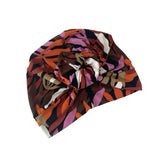 Colorful patterned headscarf on a white background