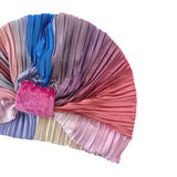 Multicolored pleated headband with a pink bow on a white background