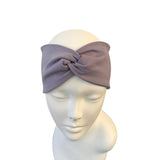 Gray headband on a mannequin head against a white background