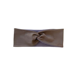 Brown headband with a knot on a white background
