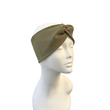 olive headband on a mannequin head against a white background