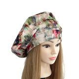 Colorful patterned headscarf on a mannequin head with long hair against a white background