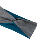 A close-up of a twisted fabric headband or wrap accessory, showing a heather gray outer layer and a teal blue inner layer, isolated on a white background.