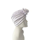 Gray textured head wrap on a mannequin head against a white background