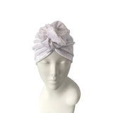 white headscarf on a mannequin head against a white background