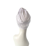Gray textured head wrap on a mannequin head against a white background