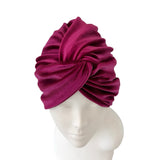 Purple headscarf on a mannequin head against a white background ireland