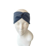 Blue headband on a mannequin head against a white background