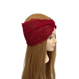 Red lace headband on a mannequin head with long brown hair against a white background