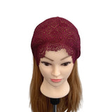 Red lace headband on a mannequin head with brown hair against a white background