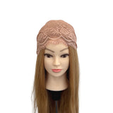 Mannequin head with brown hair and lace headband on a white background