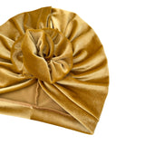 Gold velvet turban on a white background