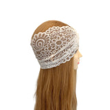 White lace headband on a mannequin head with long brown hair against a white background