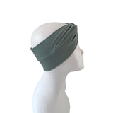 Gray headband on a mannequin head against a white background