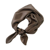 Brown headscarf tied neatly on a white background