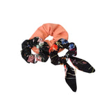 Set of floral scrunchies on a white background