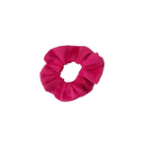 Pink scrunchie on a white background