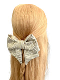 Gold zig zag patterned oversized hair bow 