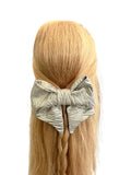 Gold zig zag patterned oversized hair bow 
