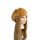 Mannequin head with a brown velvet turban on a white background