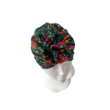 Floral patterned headscarf on a mannequin head against a white background