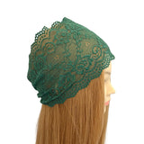 Navy lace headband on a mannequin head with long hair against a white background