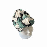 Turban with a pattern on a mannequin head against a white background