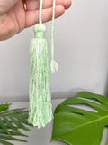 green tassel charm
