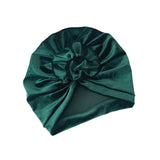 Green satin headband with a knot on a white background