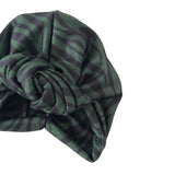 Green and black striped headscarf on a white background