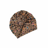 Brown headband with multicolor leopard print on a white background