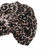 Leopard print headscarf on a white background