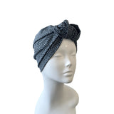 animal print patterned headscarf on a mannequin head against a white background