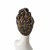 Zebra print headscarf on a mannequin head against a white background