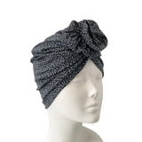 blue patterned headscarf on a mannequin head against a white background