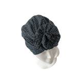 Black leopard print headscarf on a mannequin head against a white background